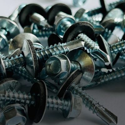 a pile of screws and washers